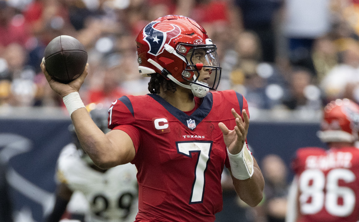Houston Texans quarterback C.J. Stroud models the team's Battle Red jerseys and helmets. 